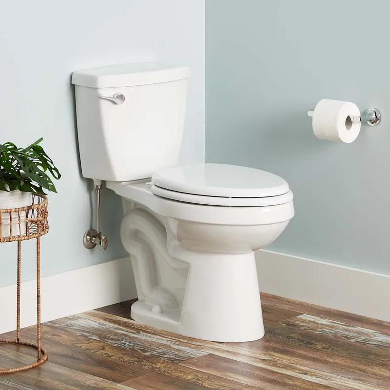 Signature Hardware Bradenton 1.28 GPF Two-Piece Elongated Toilet with 14" Rough-In and Left Hand Lever- Seat Included Final Sale